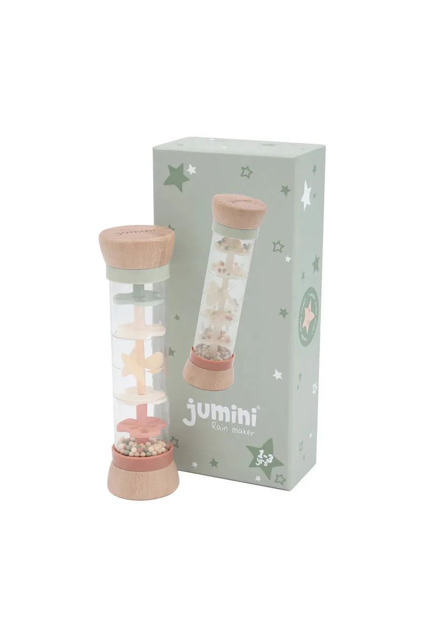 Pink rain maker with wooden accents and 'jumini' branding on a white background