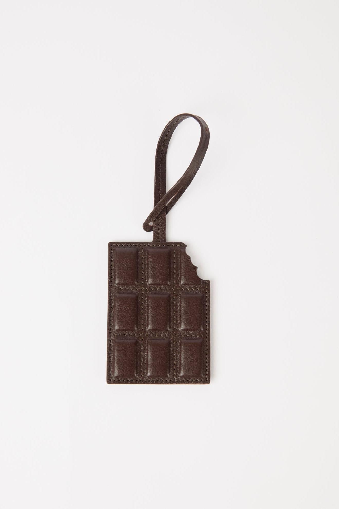 Brown leather luggage tag on a white background