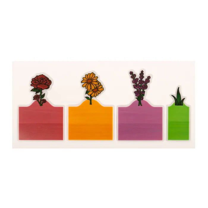 Kikkerland Annotation Garden featuring floral page tabs designed by Doreen Riso, including roses, hyacinths, yellow daisies, and blades of grass.