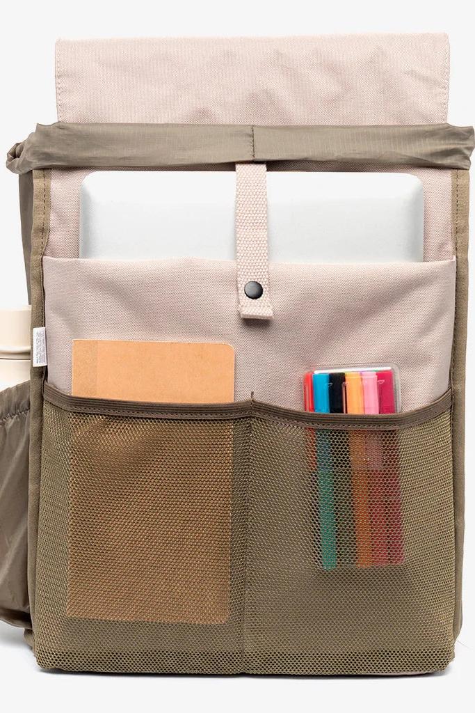 Interior view of the Lefrik Scout Backpack in Ash, revealing a spacious main compartment with a padded laptop pocket, two organisers, and an interior bottle pocket.