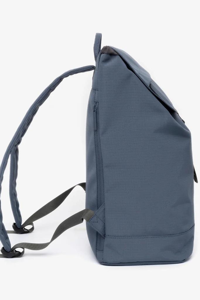Side profile of the Lefrik Scout Backpack, highlighting its straps and zip pocket on the side.