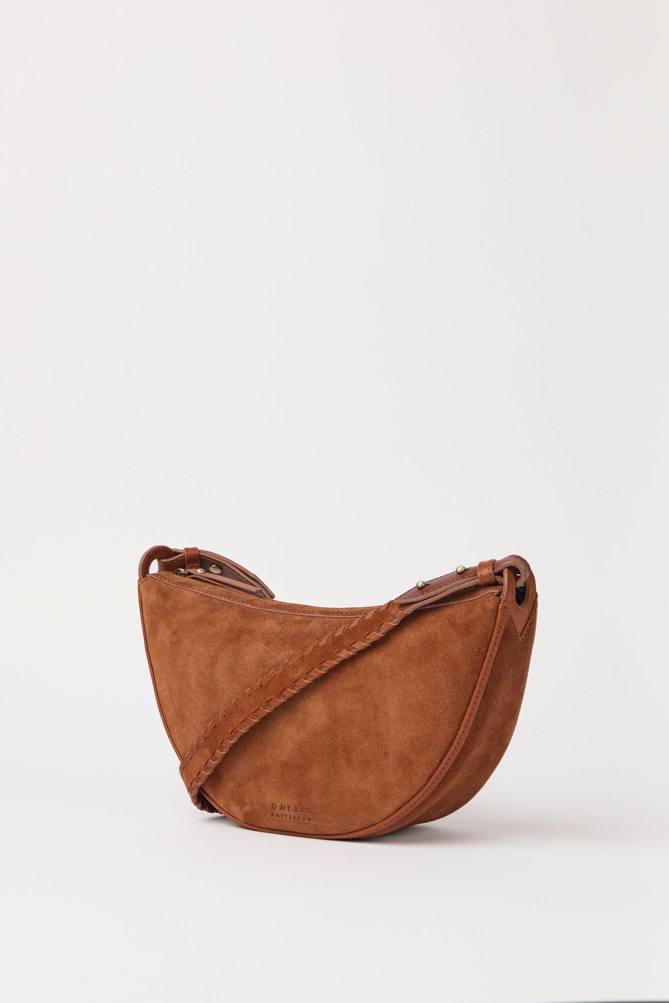 Brown leather handbag on a white background