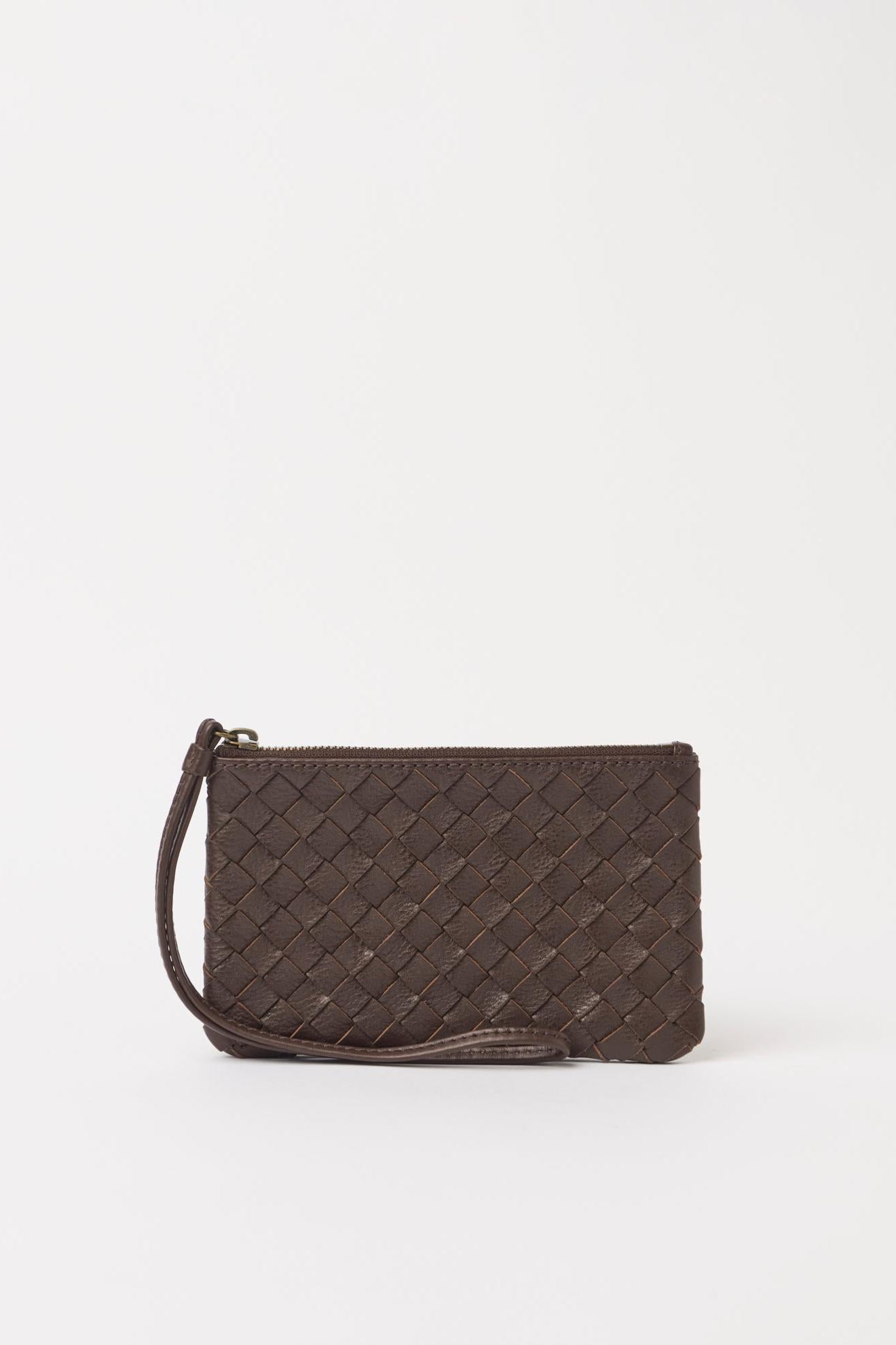 Brown woven clutch bag on a white background