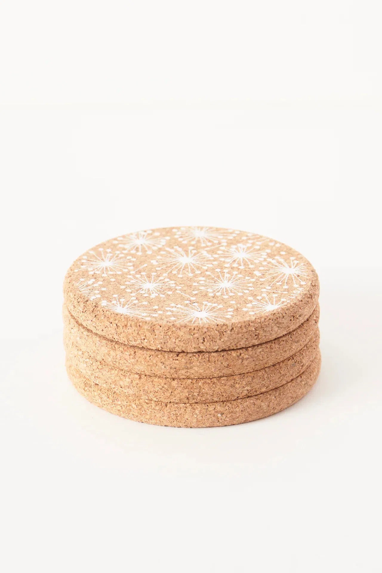 Liga Cork Coasters with a dandelion illustration stacked.