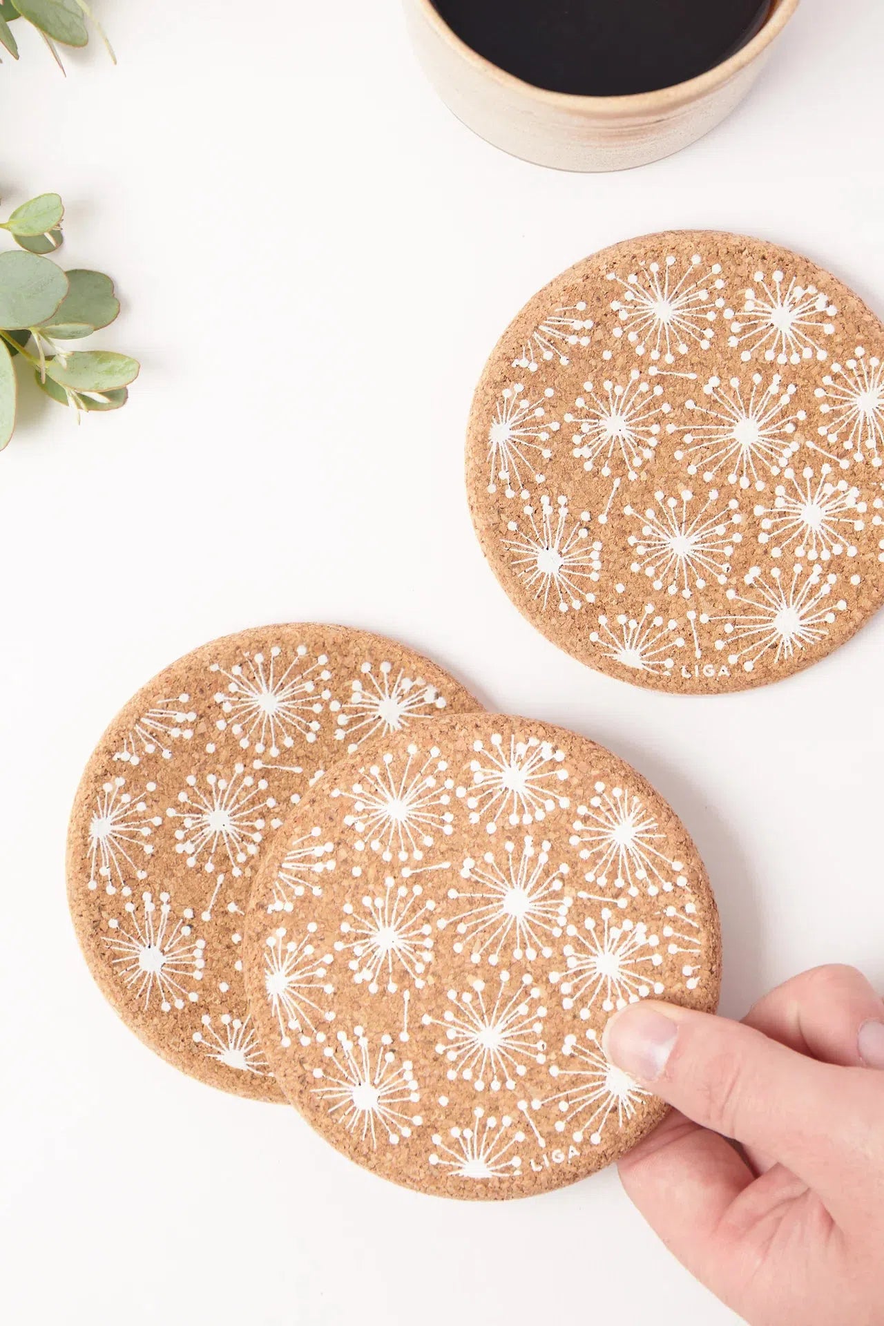 Liga Cork Coasters with a dandelion illustration, made from sustainable cork.