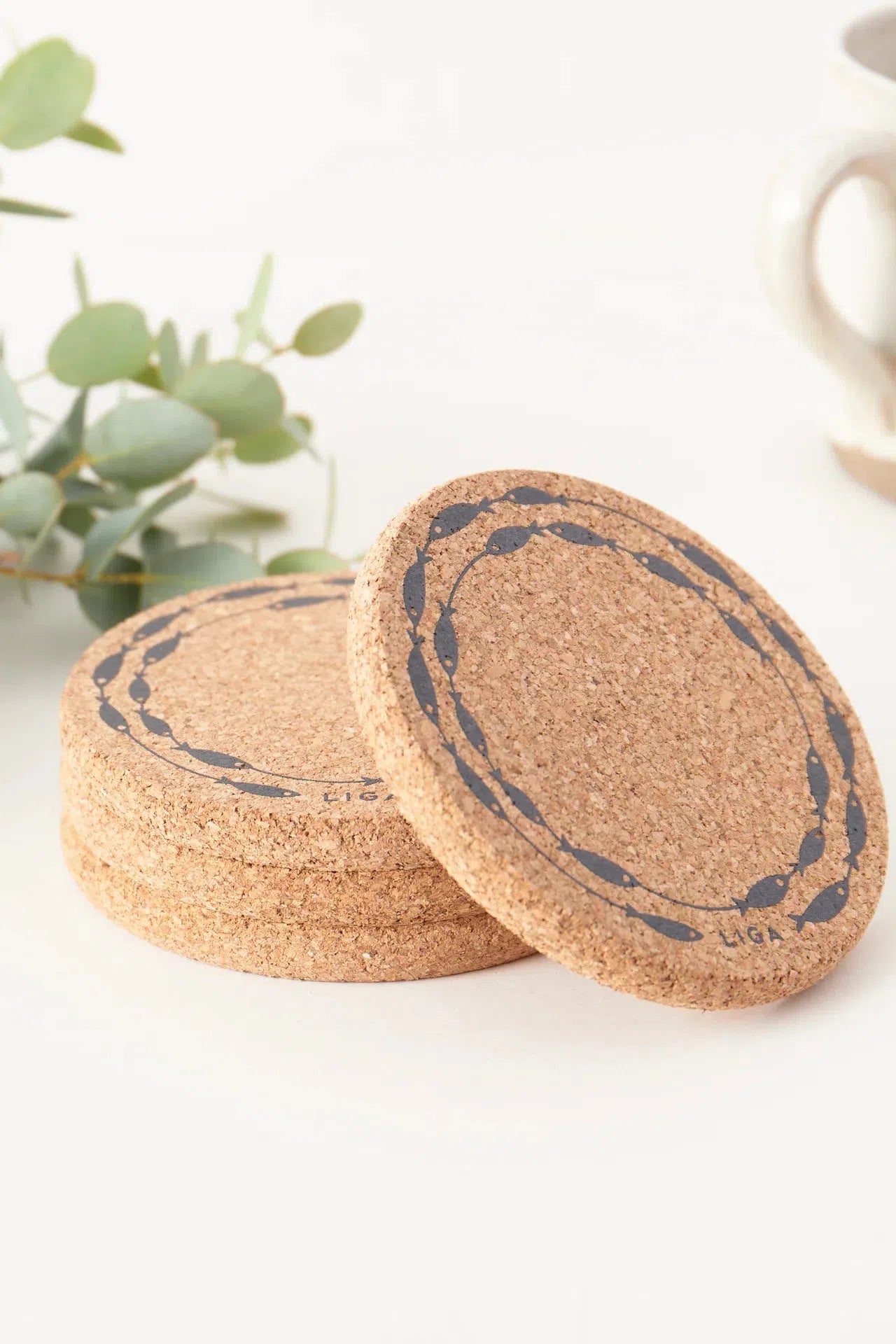 Liga Cork Coasters stacked on a table.