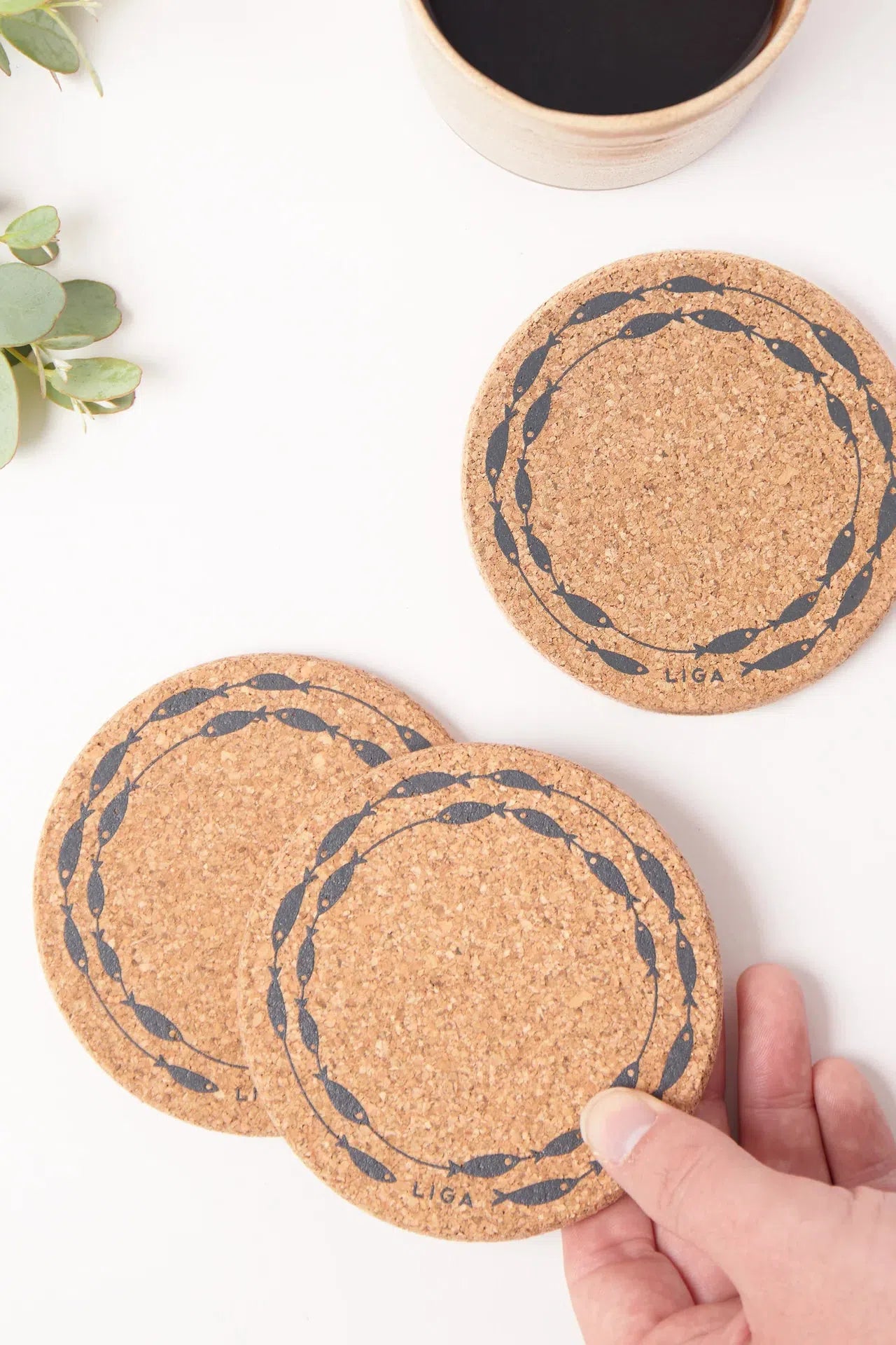 Liga Cork Coasters featuring a playful fish-on-a-line design, made from eco-friendly cork.