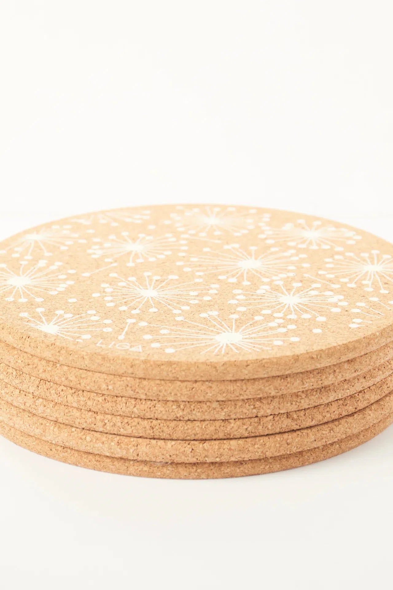 Detailed view of Liga Cork Placemats, stacked.