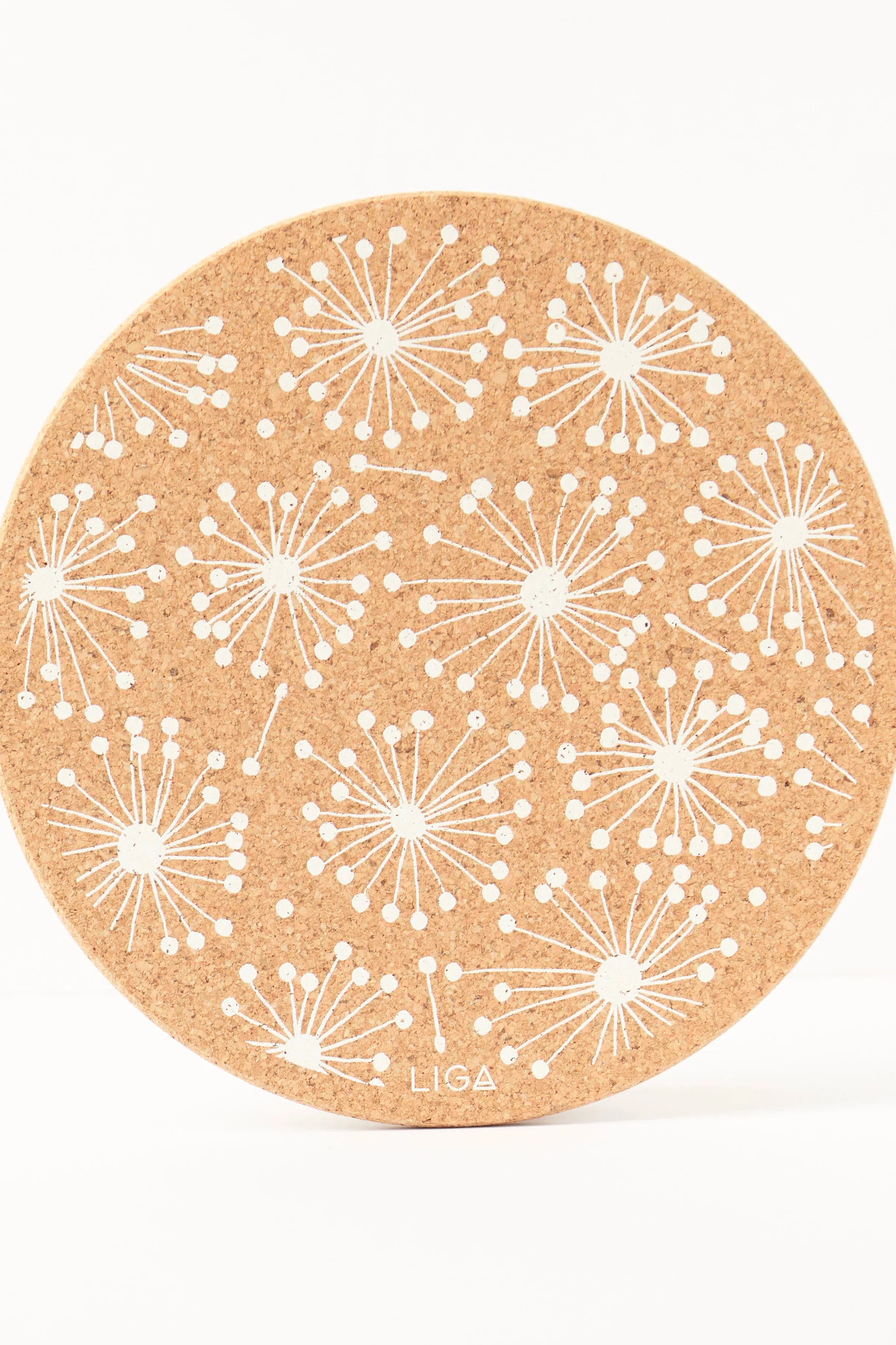Liga Cork Placemat with a dandelion illustration, made from sustainable cork.