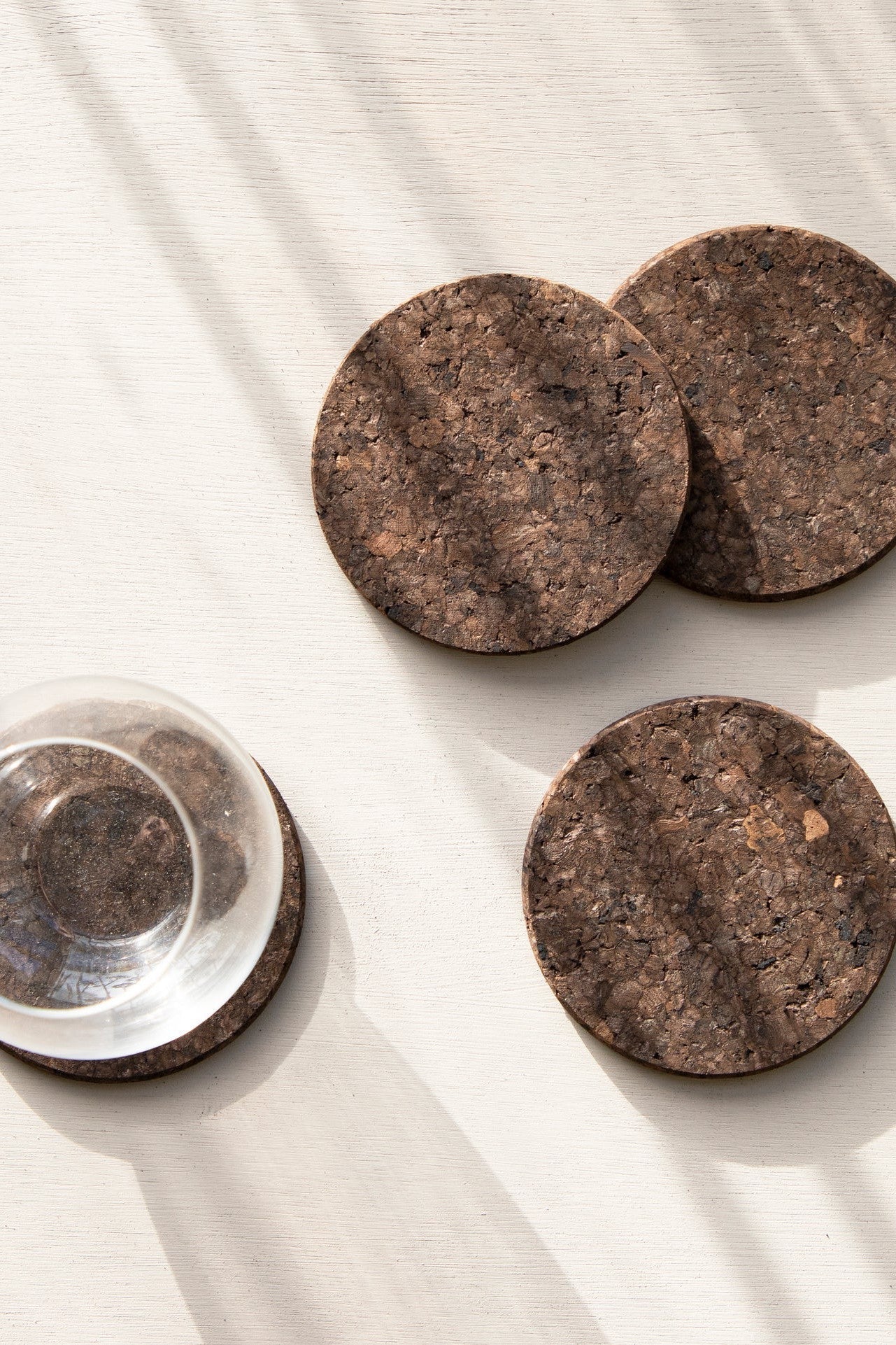 Set of four Liga Smoked Cork Round Coasters with a warm, contemporary smoked finish.