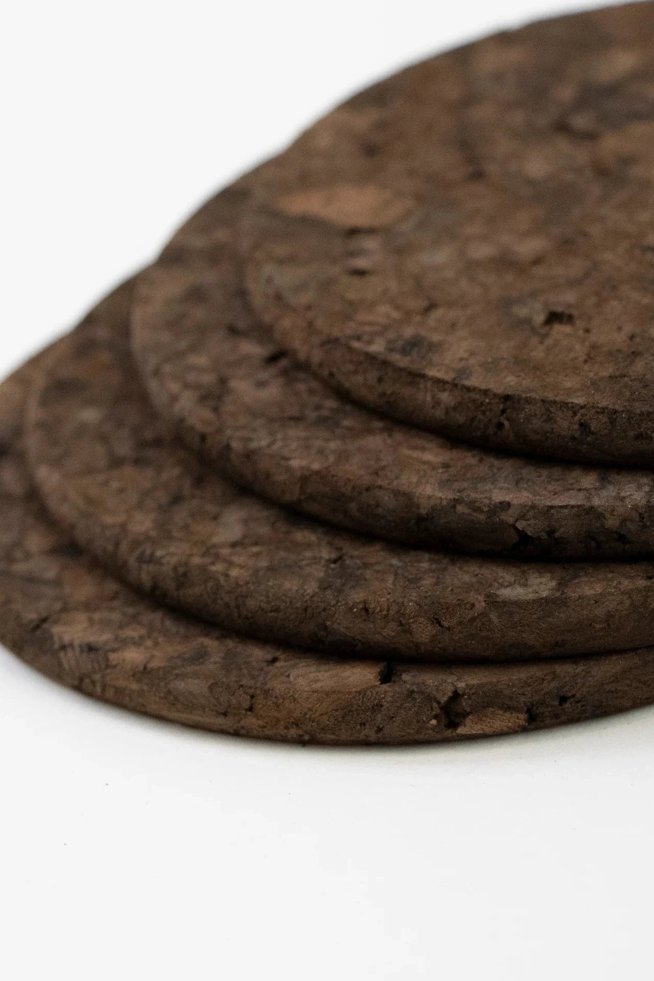 Detailed view of Liga Smoked Cork Round Coasters, highlighting its natural cork texture and unique smoked tones.