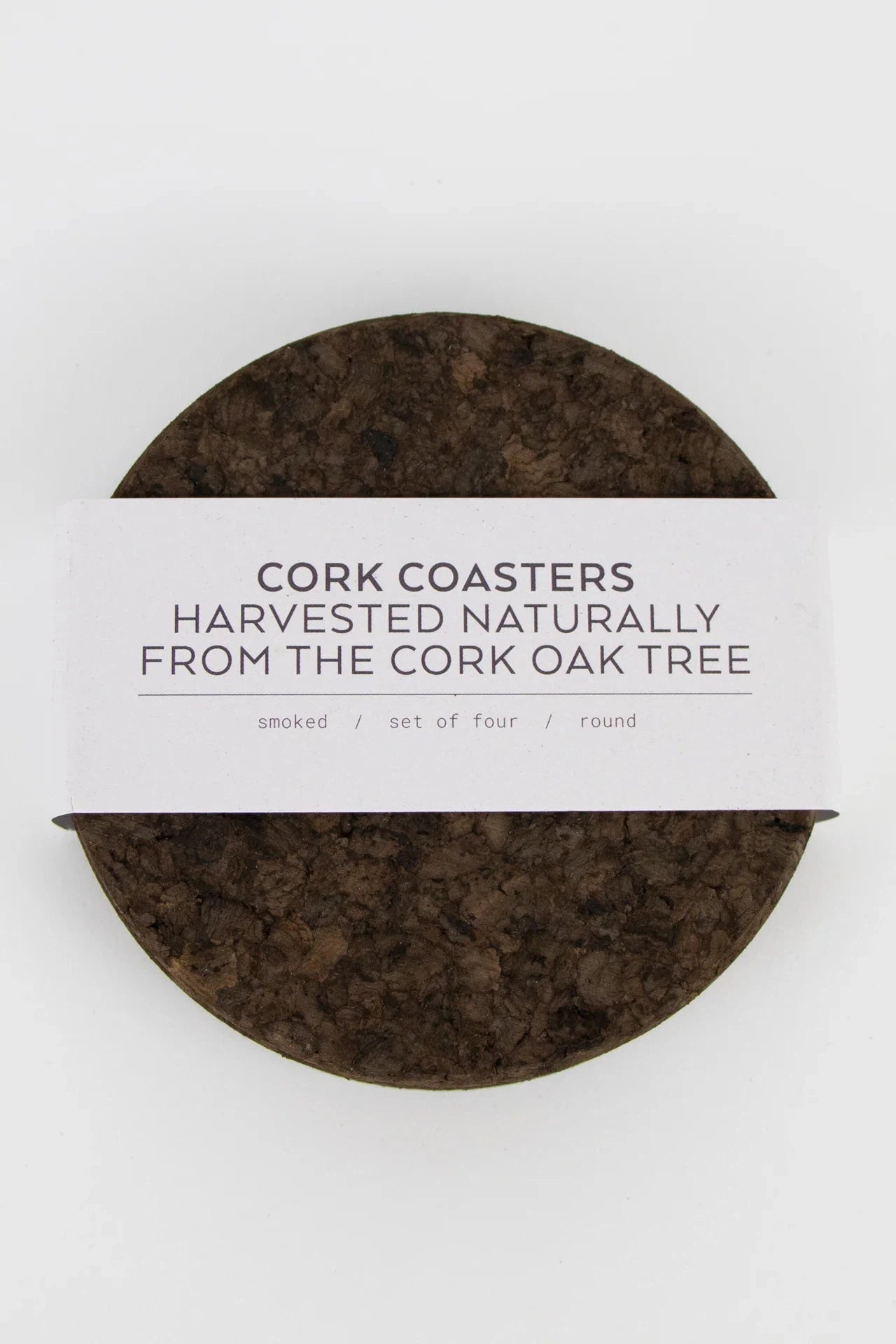 Set of four Liga Smoked Cork Round Coasters with white band packaging.