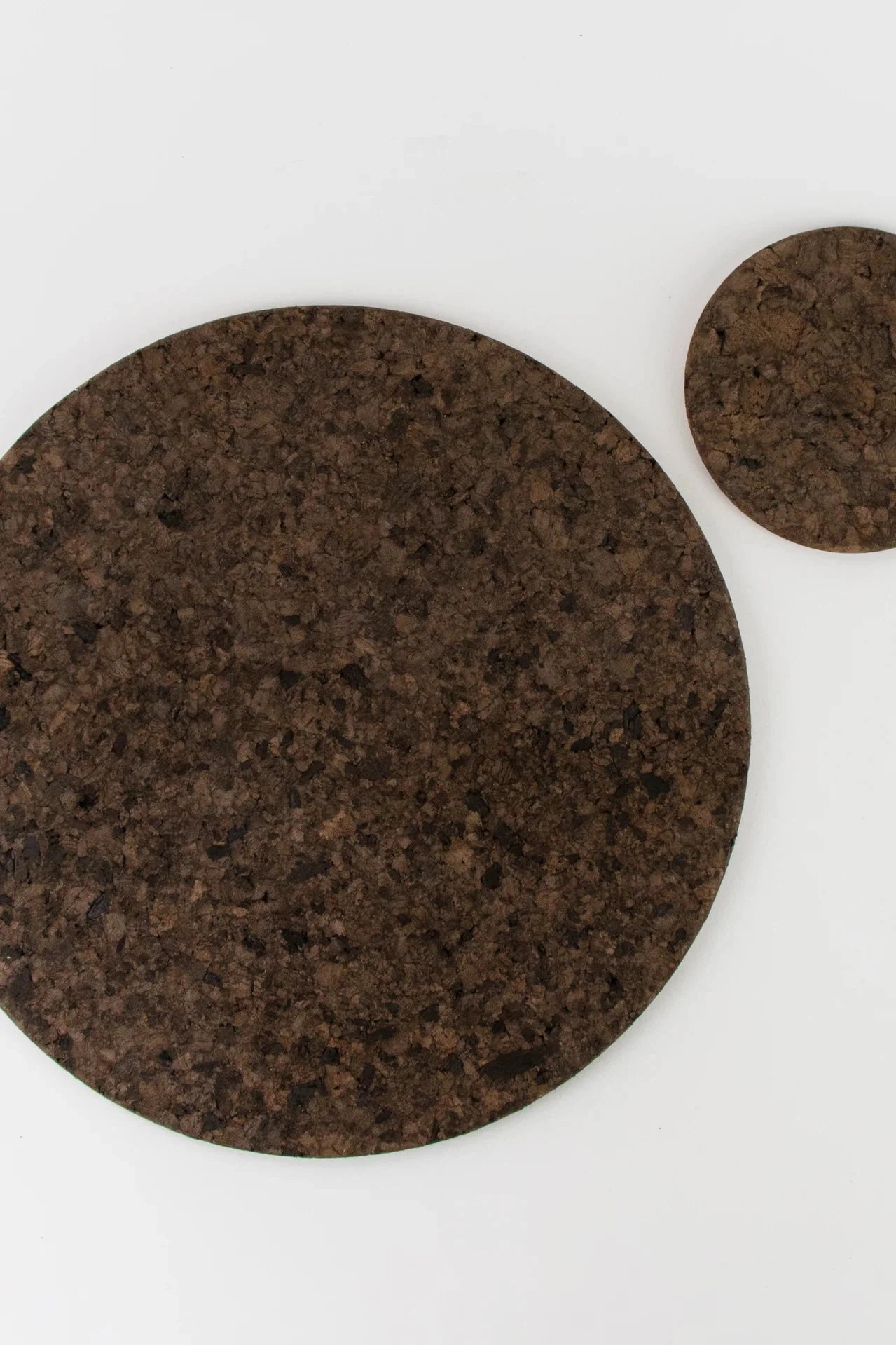 Liga Smoked Cork Round Placemat with matching coaster.