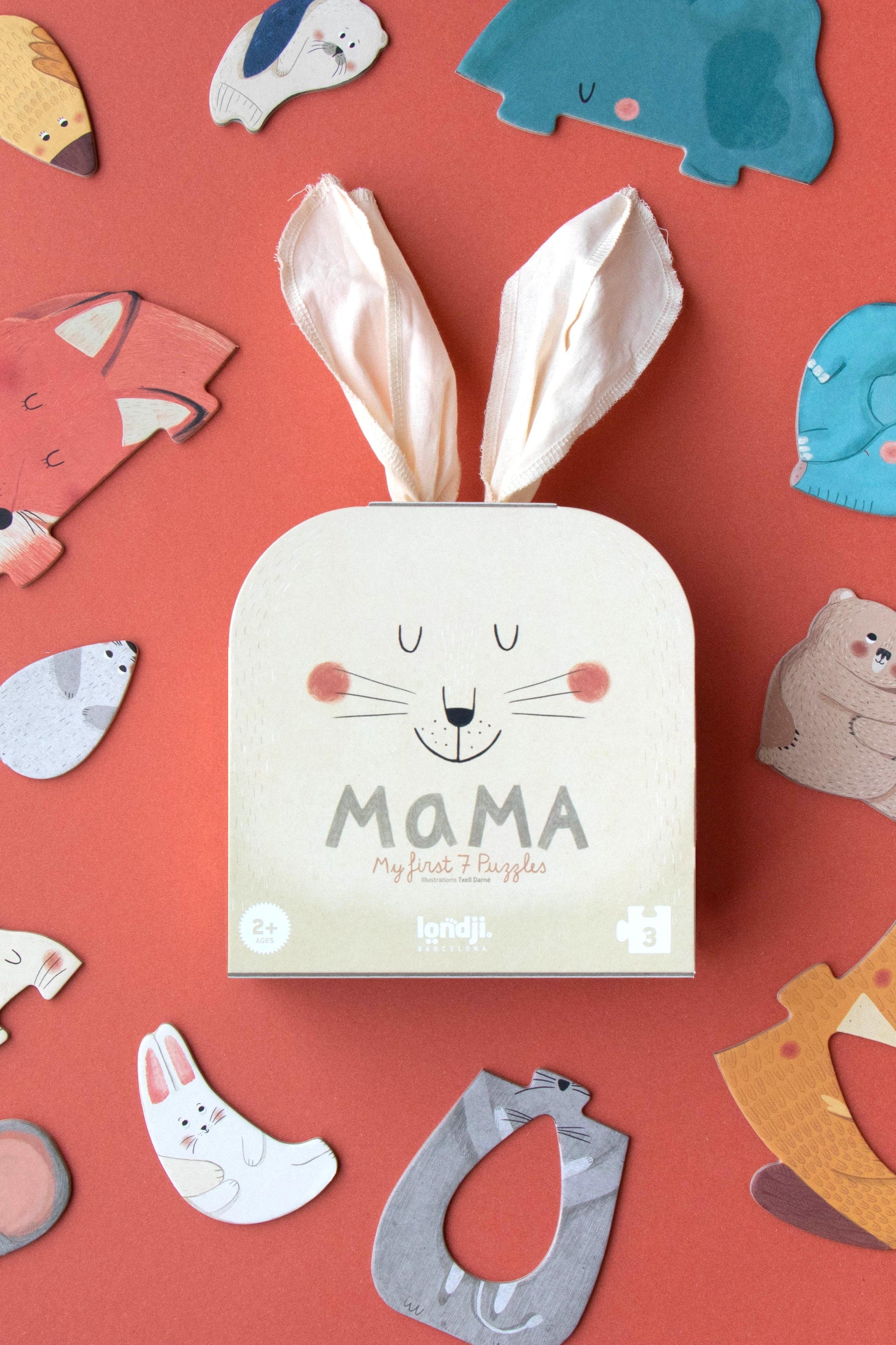 Baby product packaging with bunny ears on a red background with animal illustrations