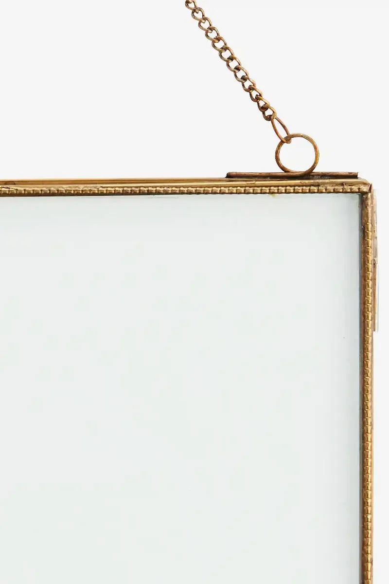 Gold picture frame with chain on a white background