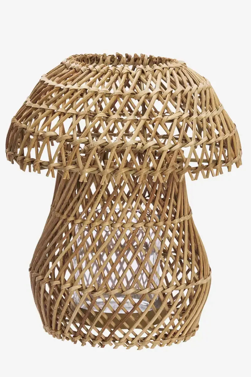 Woven rattan lantern on a white background