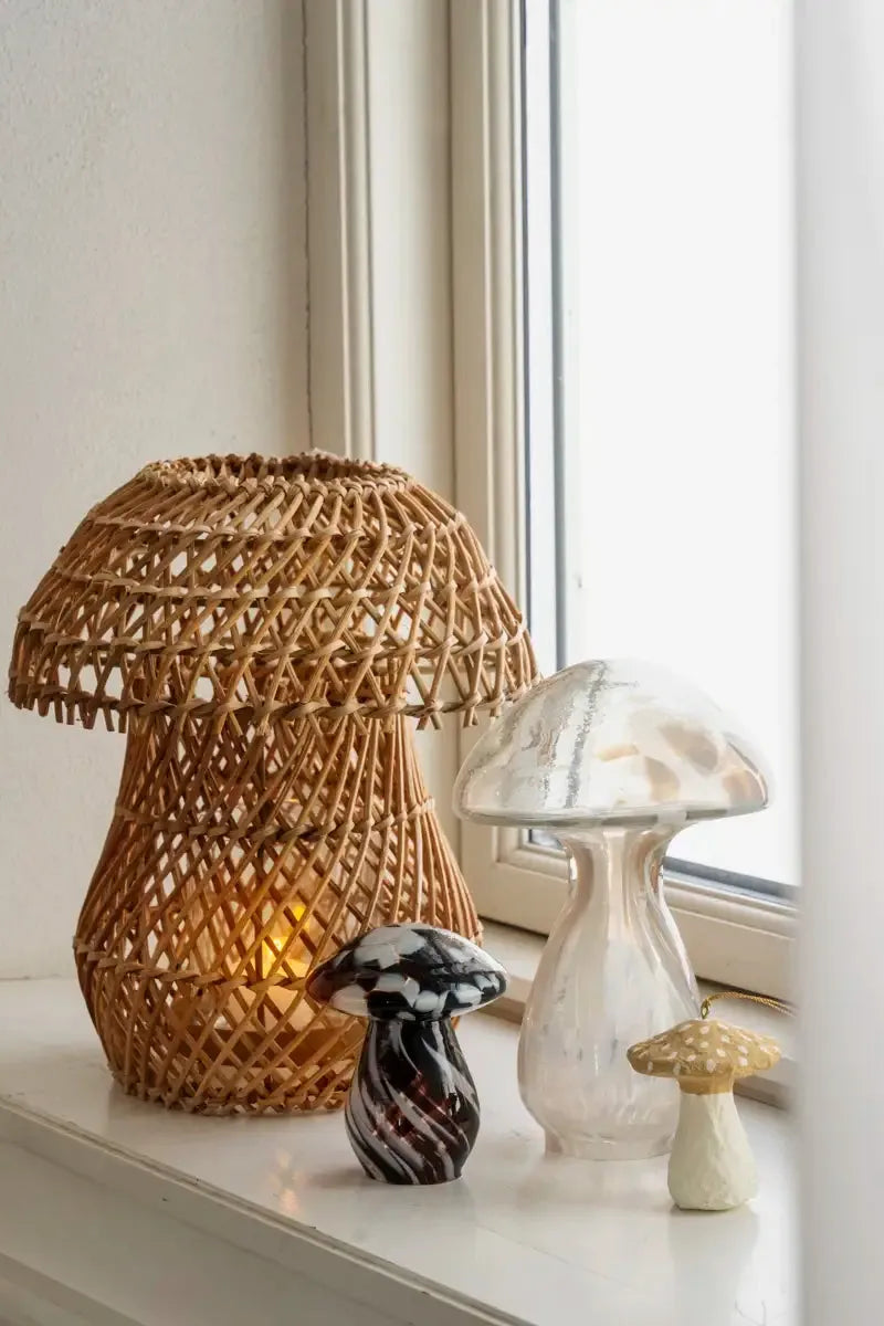 Decorative mushroom-shaped rattan lantern on a windowsill