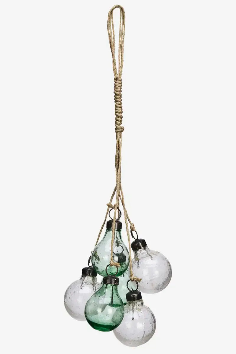Hanging decorative glass bulbs on a white background