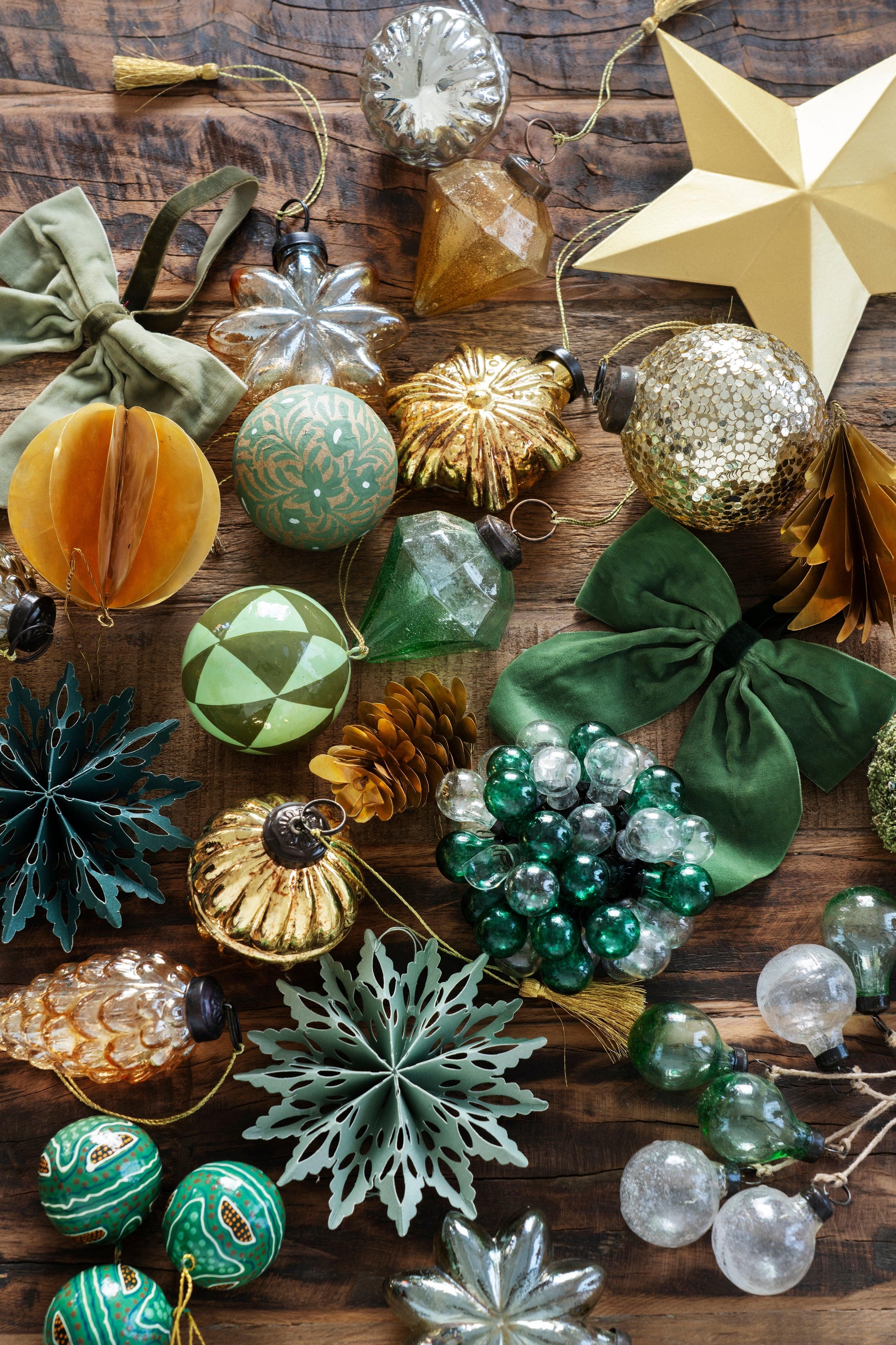 Assorted Christmas ornaments on a wooden surface