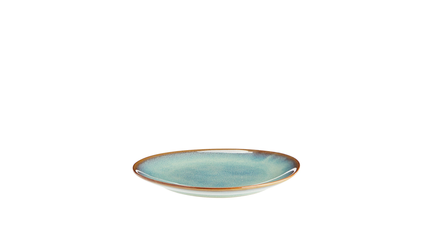 Ceramic plate with a blue glaze on a white background