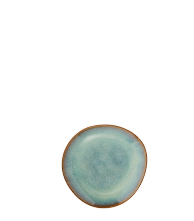 Round ceramic plate with a light blue glaze on a white background