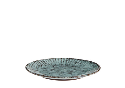 Round ceramic plate with textured surface on a white background