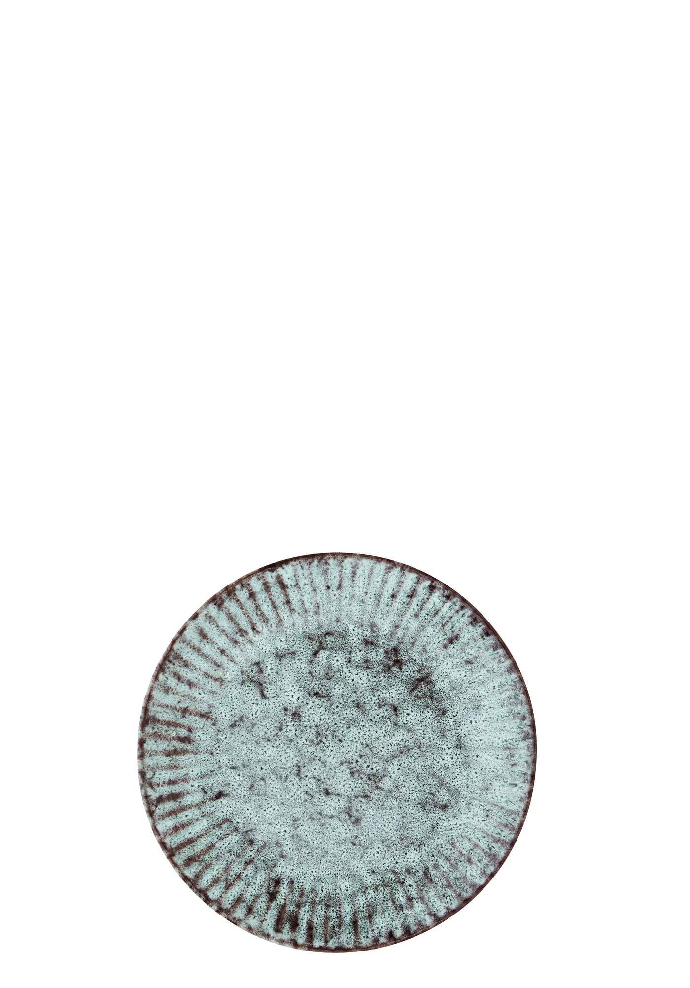 Round ceramic plate with textured surface on a white background