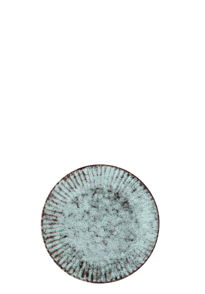 Round ceramic plate with textured surface on a white background