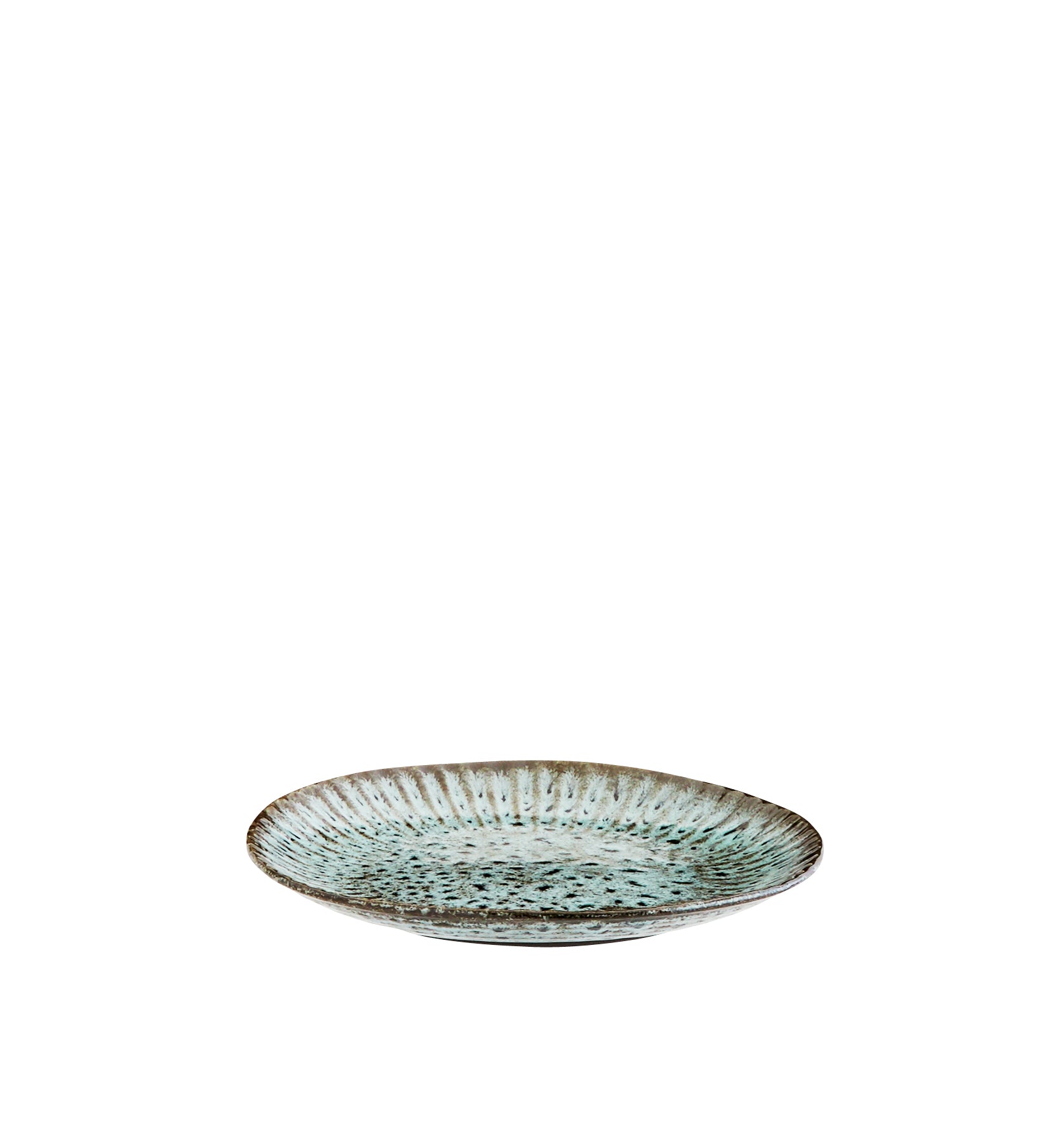 Round ceramic plate with textured surface on a white background