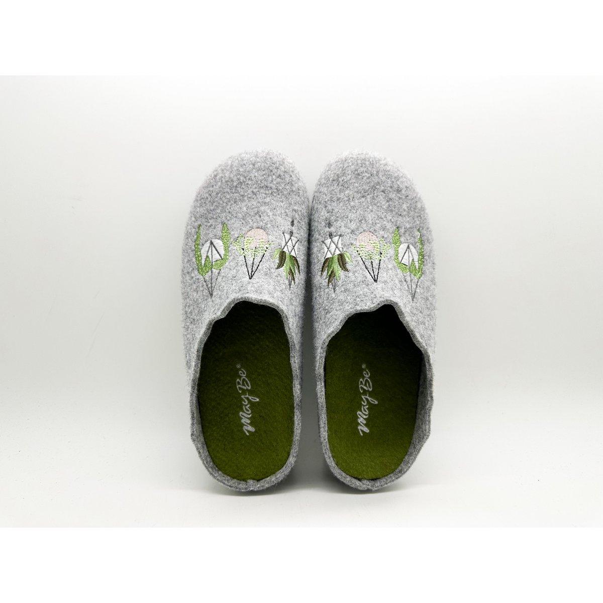 Pair of gray recycled slippers with green soles on a white background
