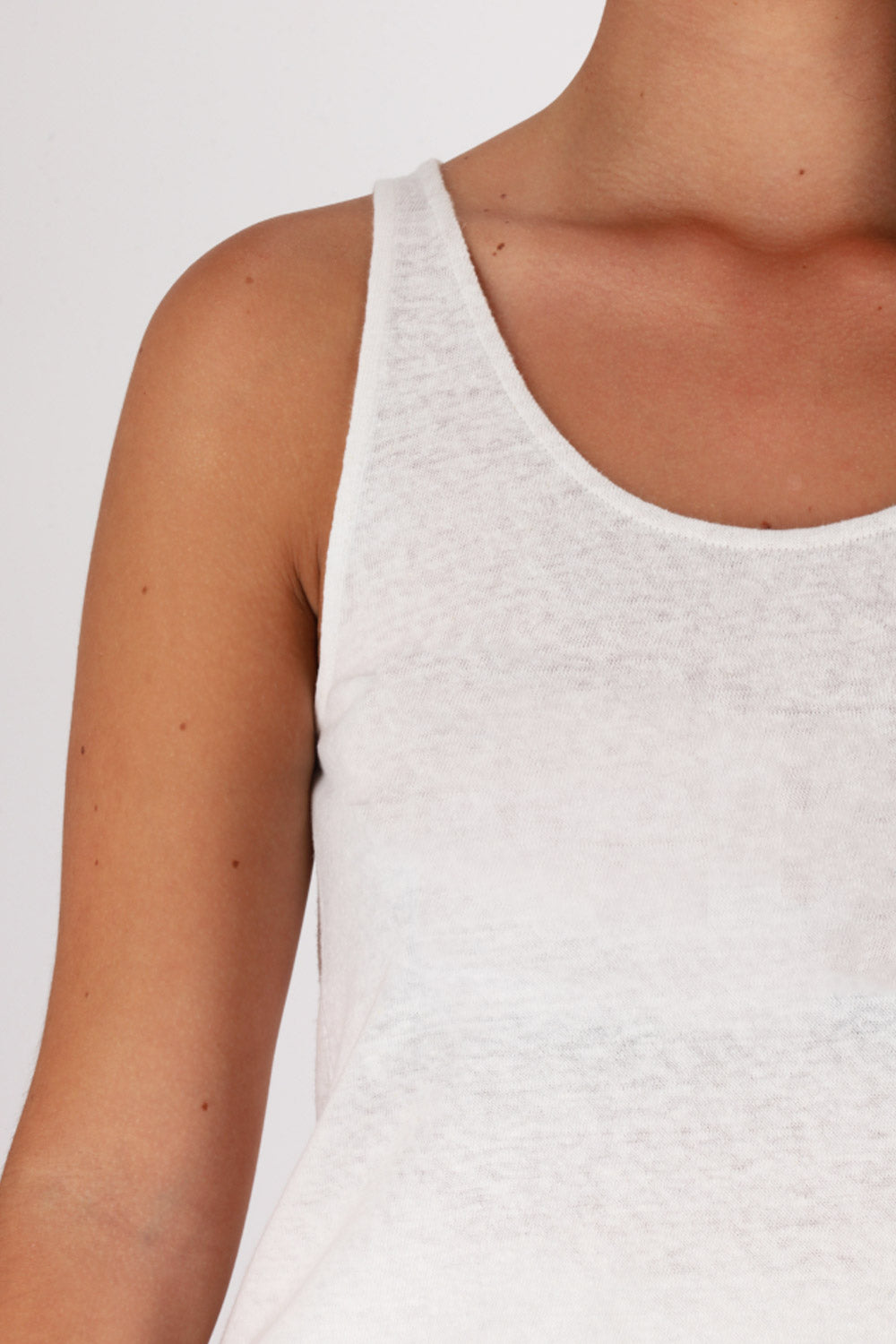 Close up of rounded neckline and contrasting topstitching.