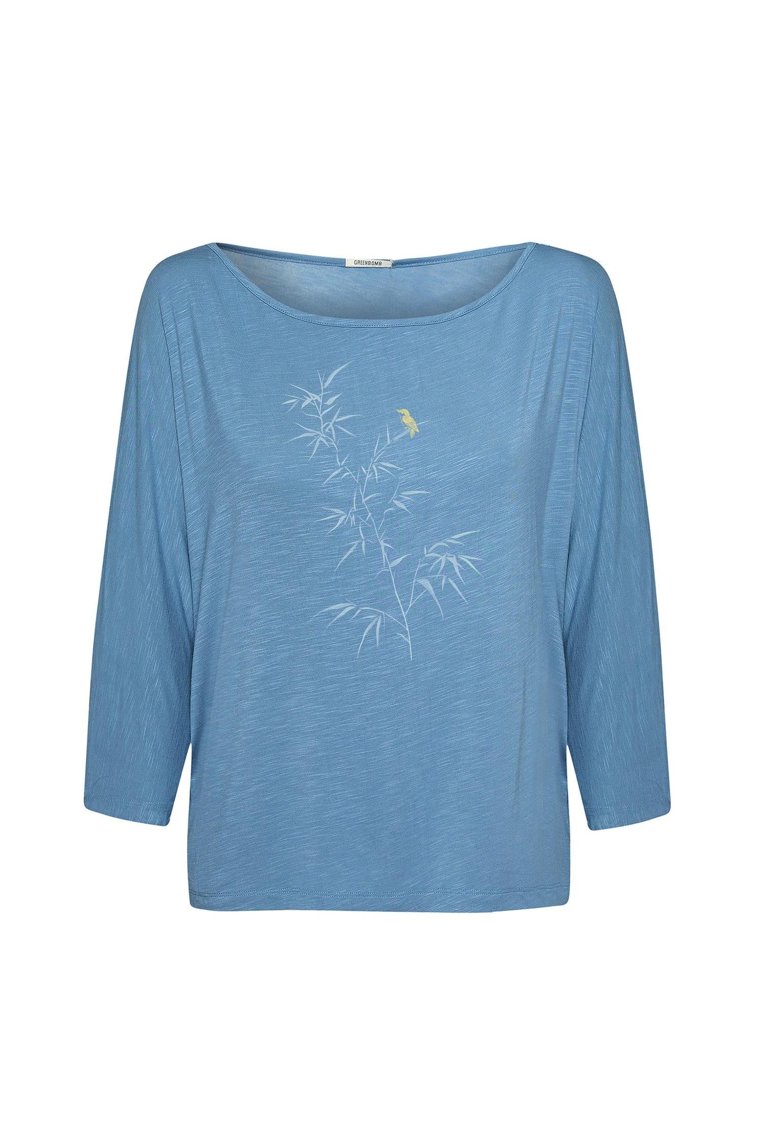 Blue eco-vero shirt with floral design on a white background