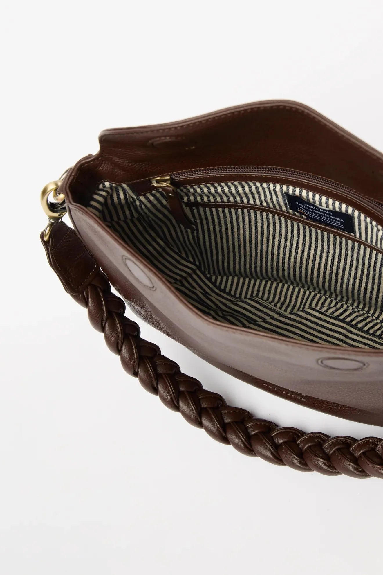 Brown handbag with braided handle on a white background
