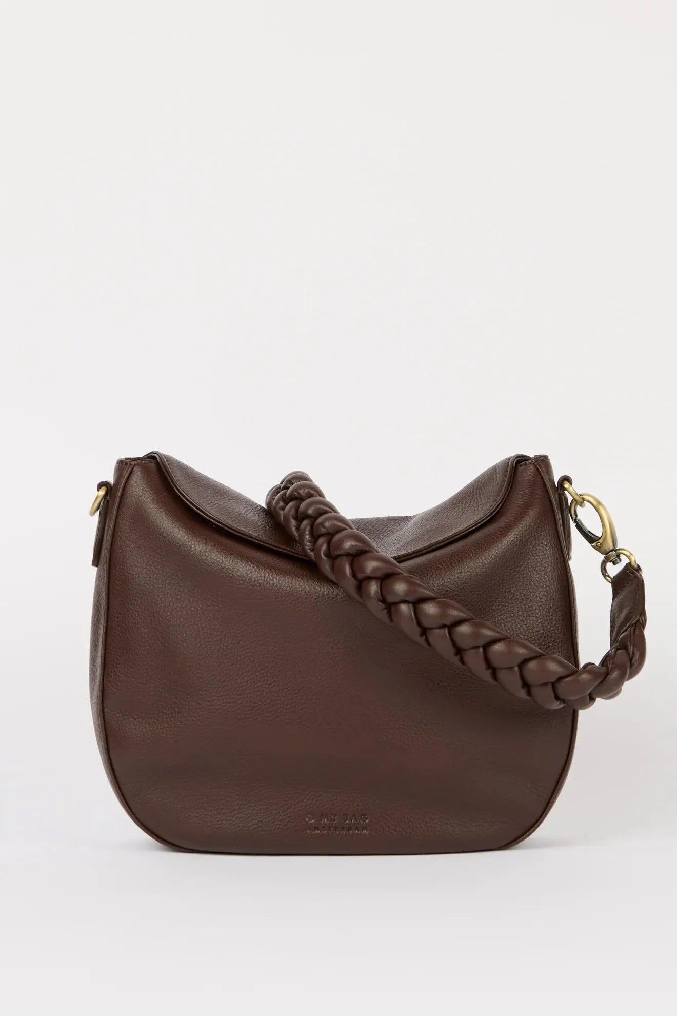 Brown leather handbag with braided handle on a white background