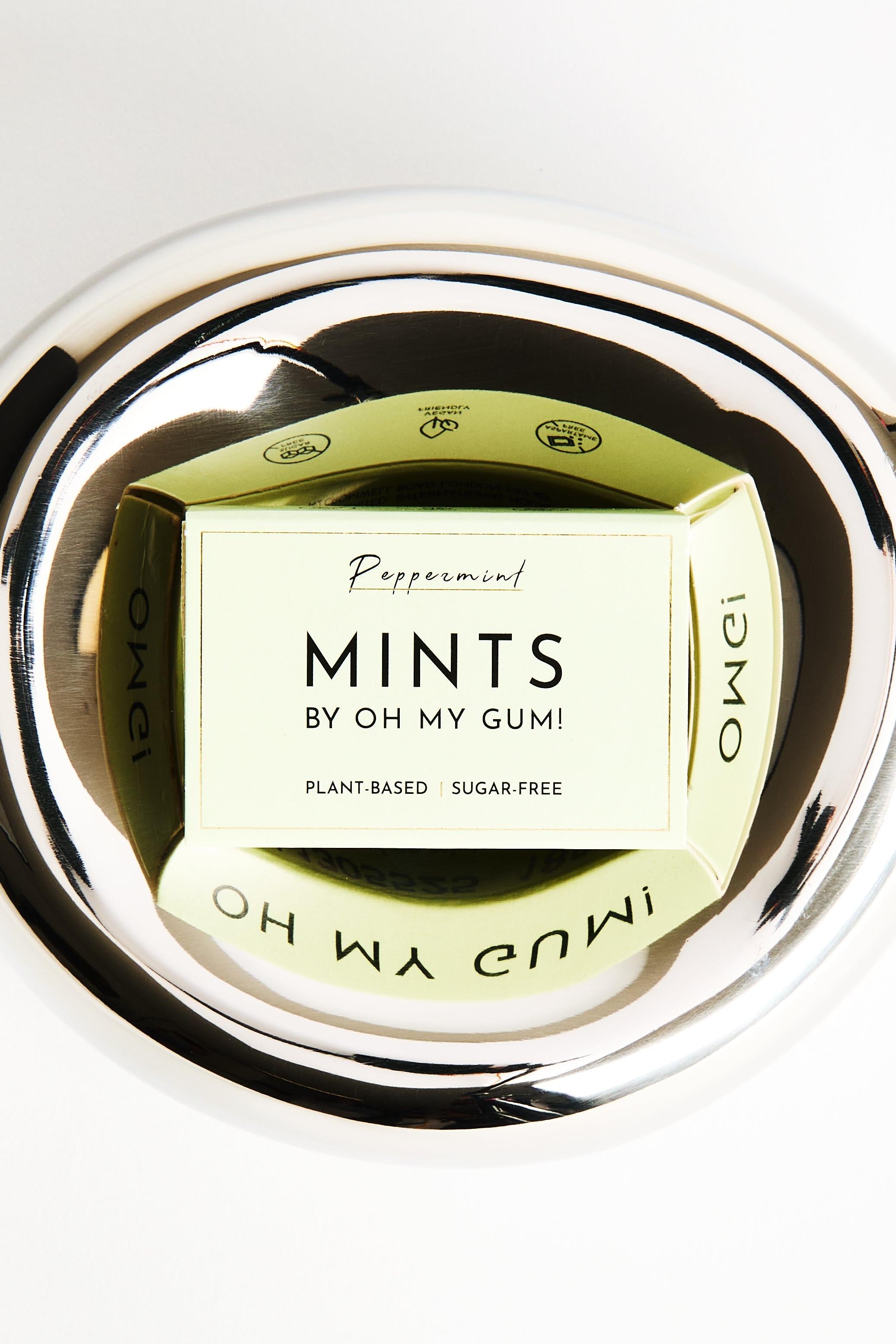 OH MY GUM! Sugar-Free Mints in a green box on a metallic tray