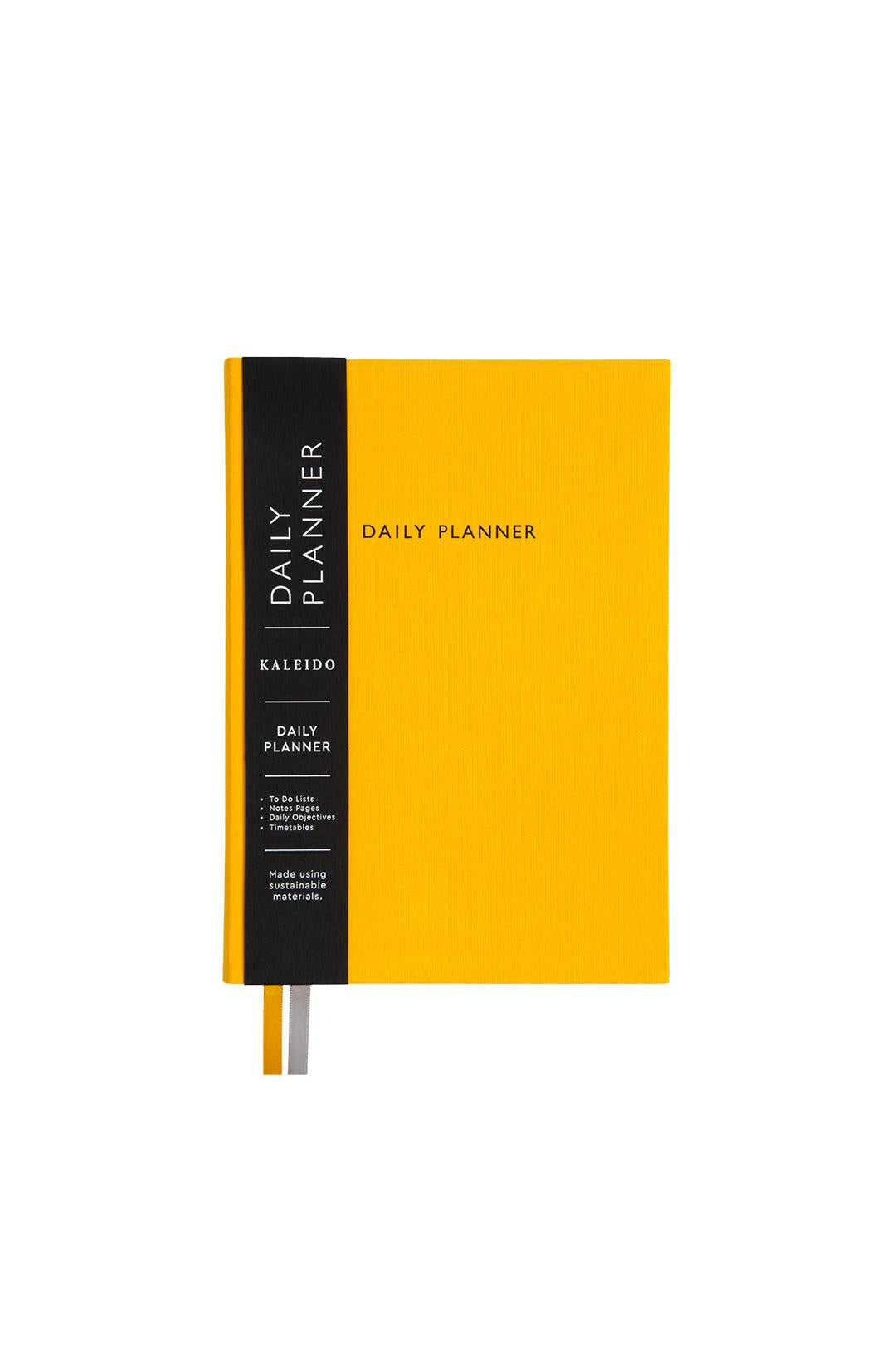 Yellow daily planner with black spine on a white background