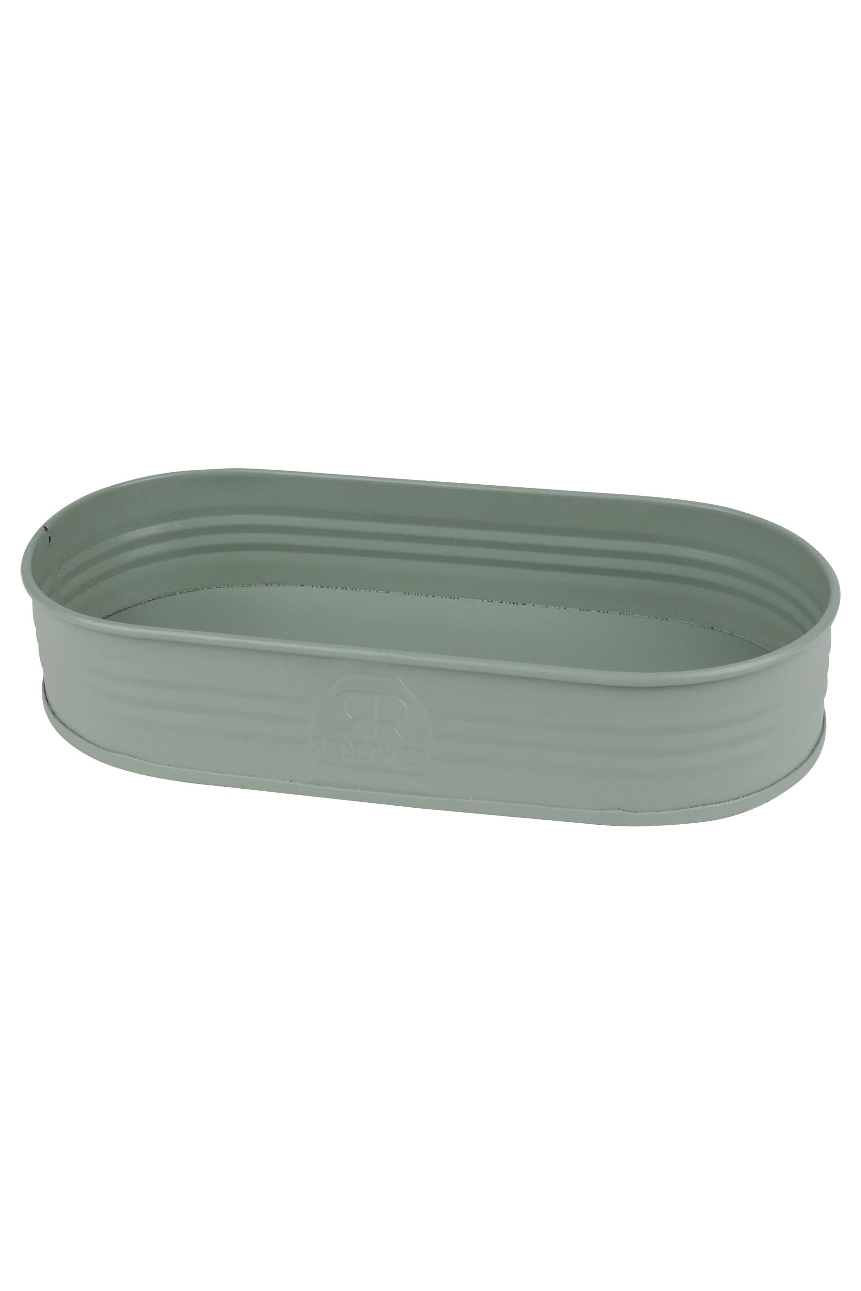 Green metal planter on a white background