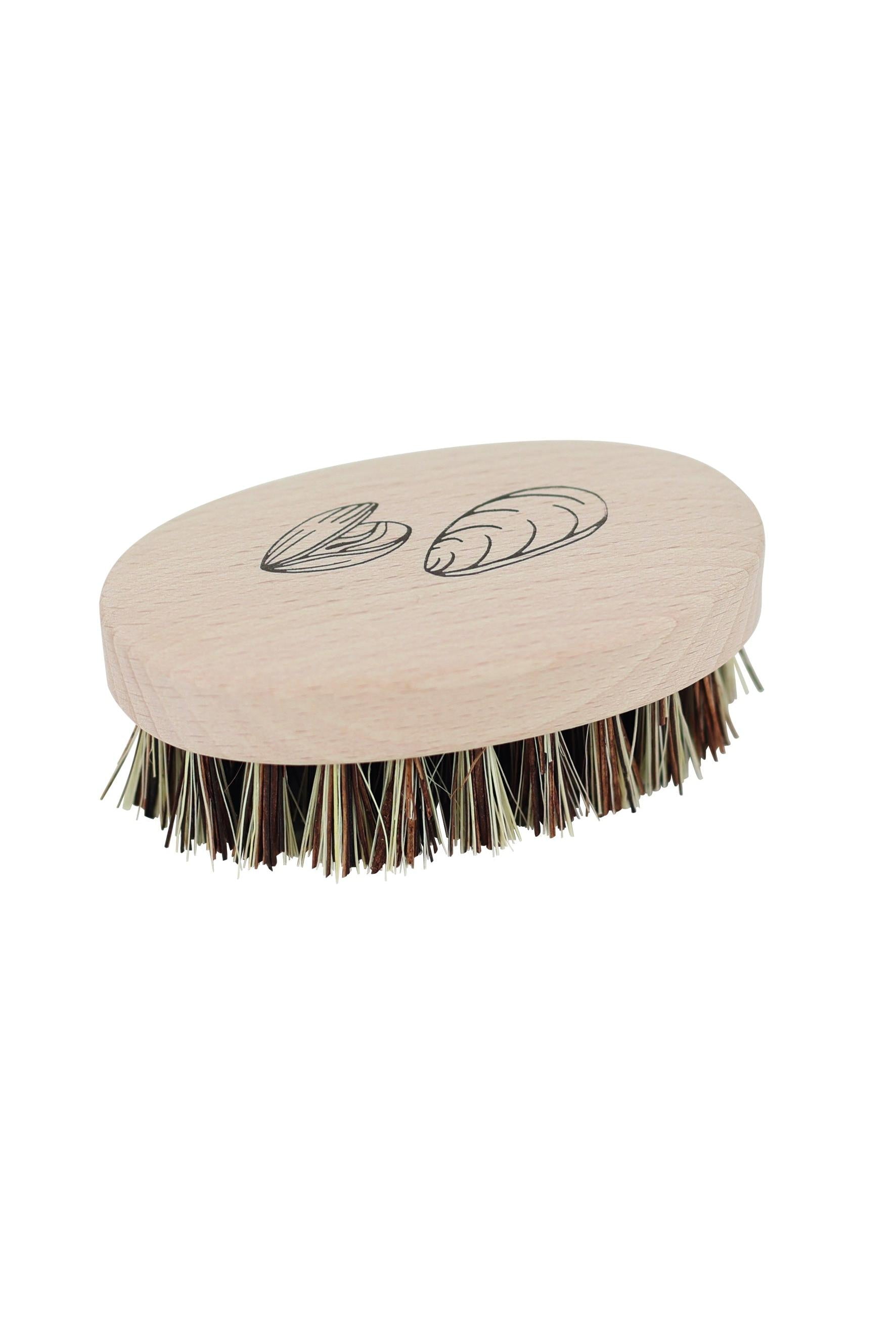 Beige mussel brush with black bristles on a white background