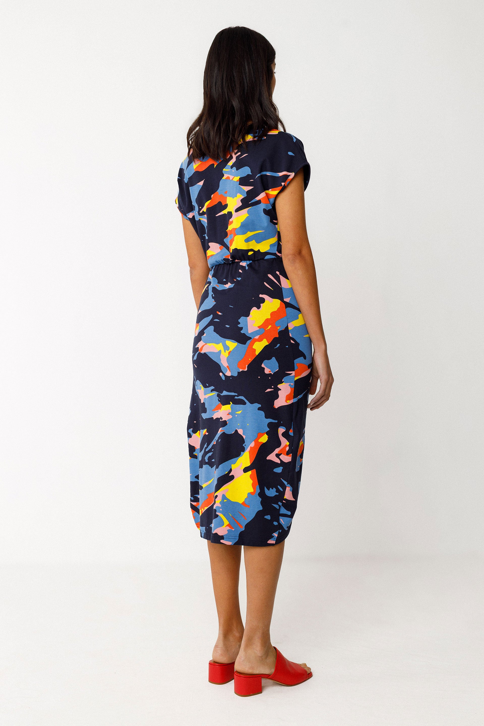 Back view of model wearing SKFK colourful knee length dress