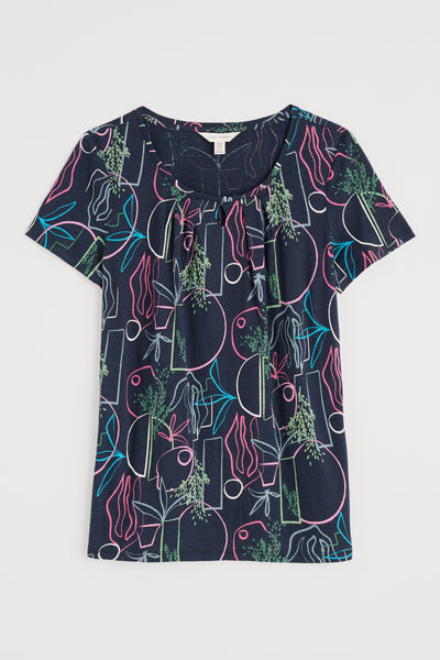Flat lay of the Seasalt Appletree T-shirt, showing scoop neck and full floral print pattern.