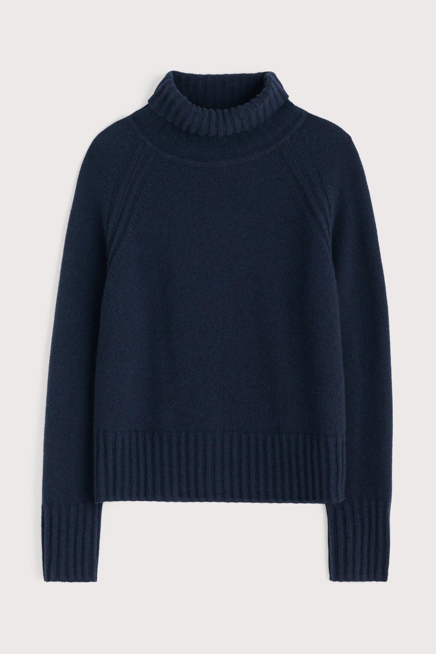 Navy blue sweater on a light gray background