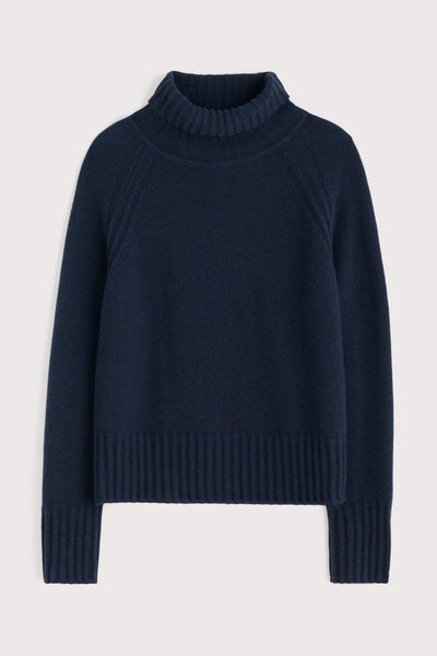 Navy blue sweater on a light gray background