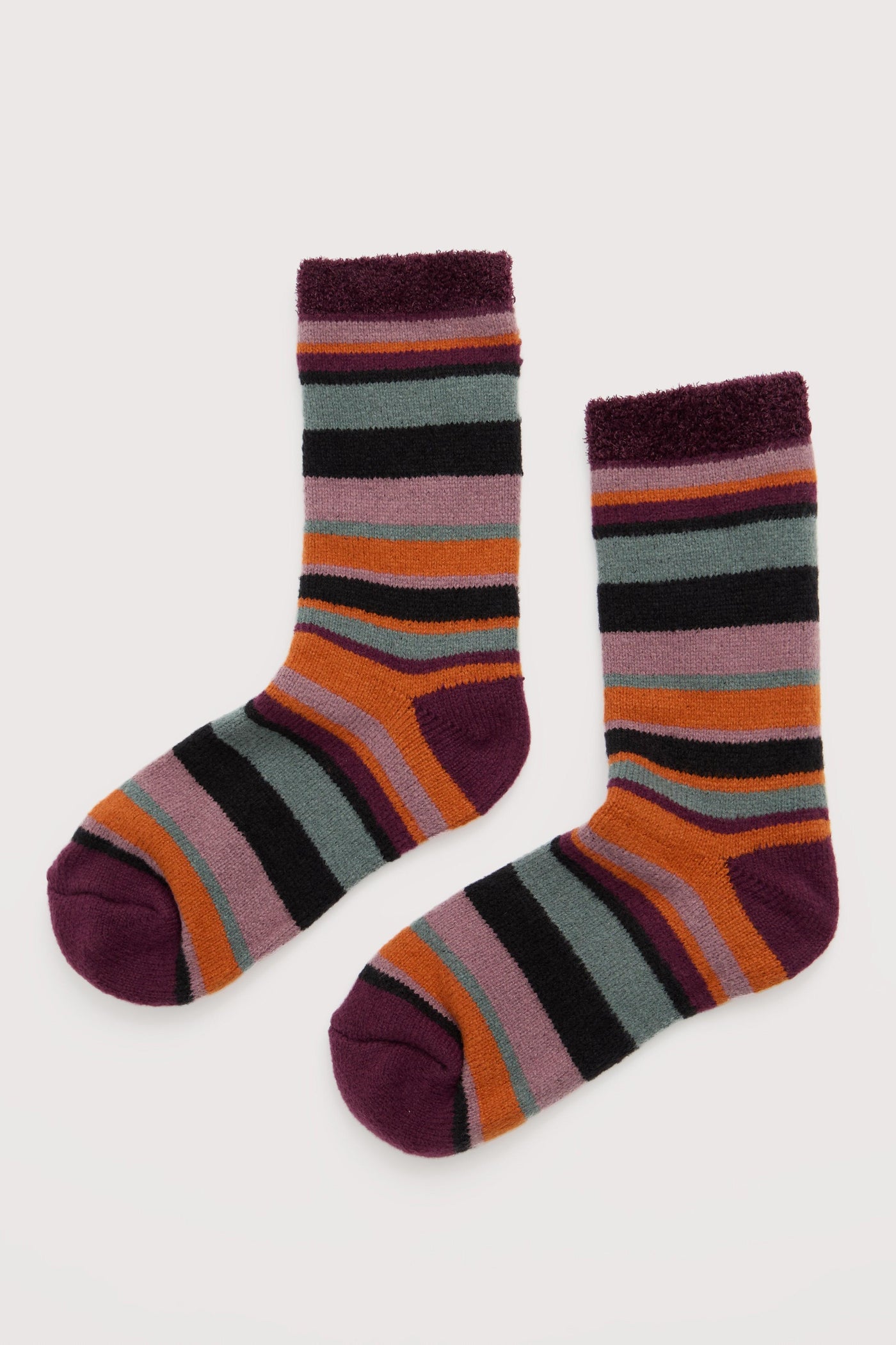 Pair of striped socks on a light gray background