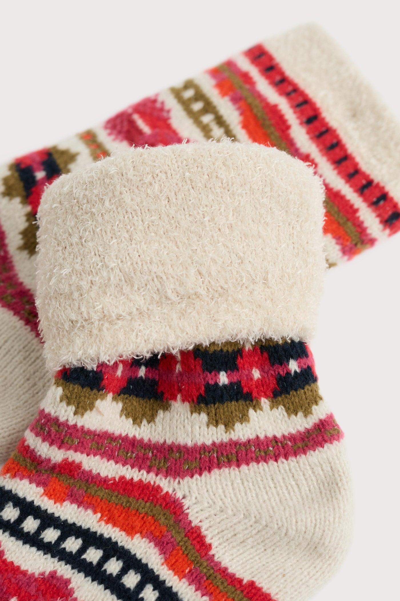 Pair of patterned socks with a fluffy texture on a white background