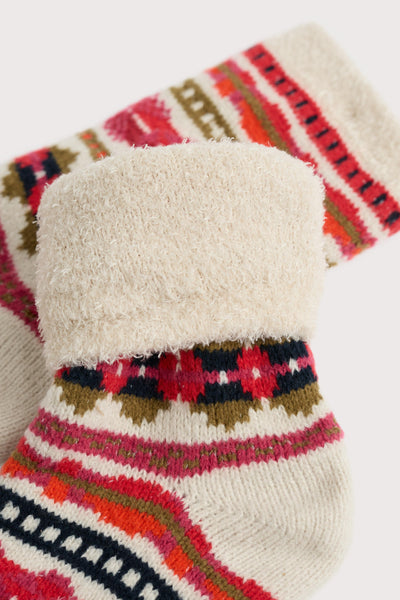 Pair of patterned socks with a fluffy texture on a white background