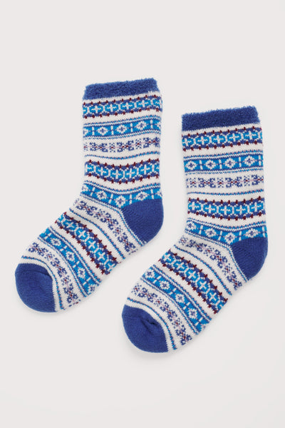 Pair of blue and white patterned socks on a light gray background