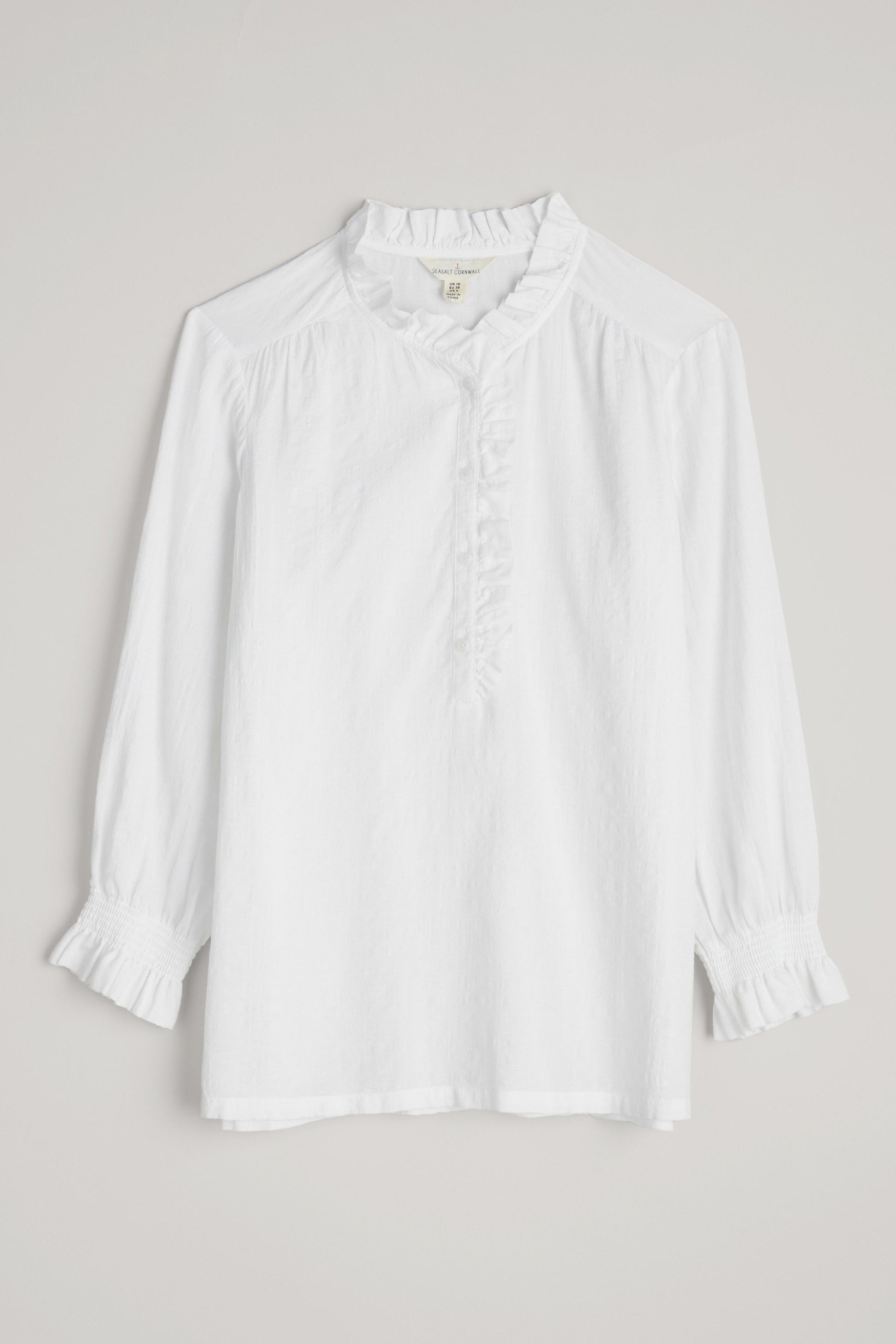 White blouse on a light gray background