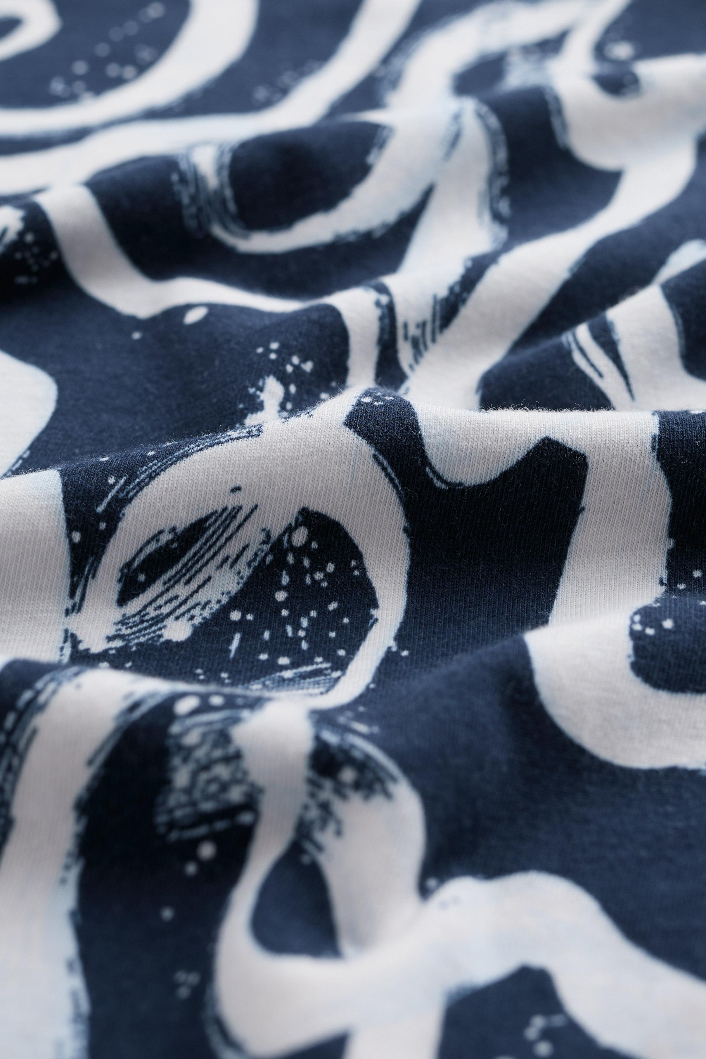 Close-up of navy blue fabric with white abstract patterns