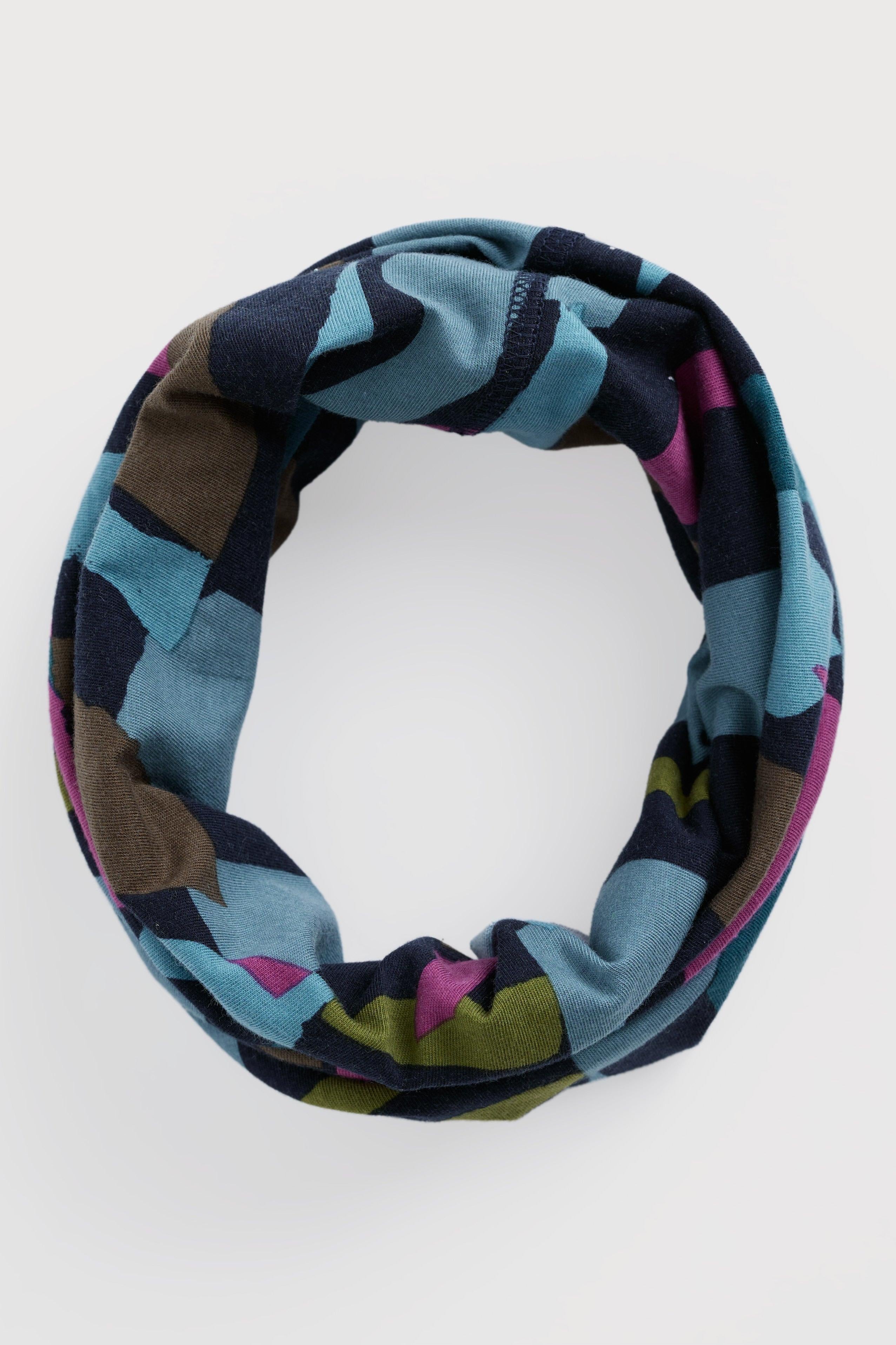 Multicolored patterned headband on a white background