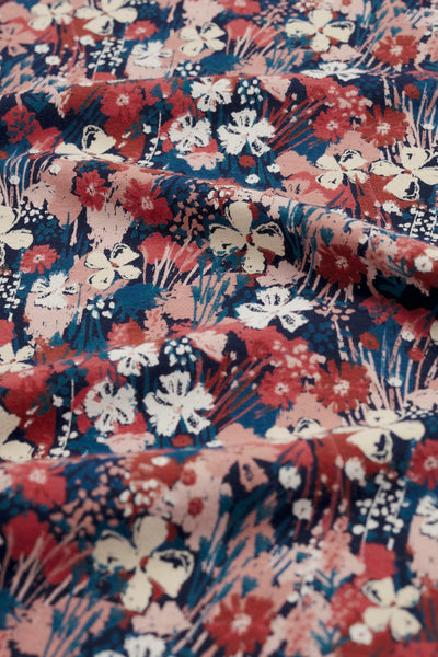 Floral organic cotton fabric pattern with red, blue, and white colors.